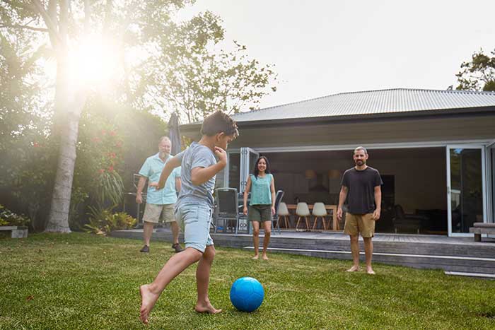 family playing in back yard