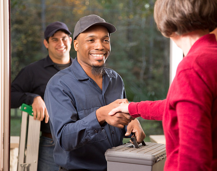 Exterminators greeting customer